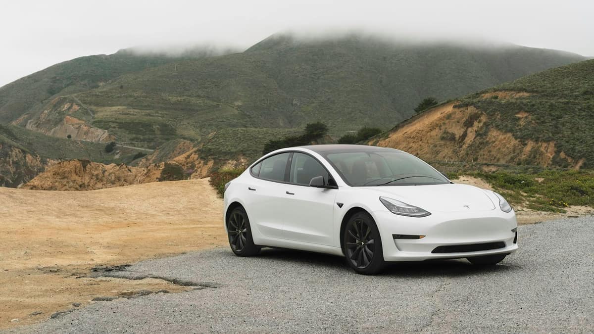 White electric car on an urban street