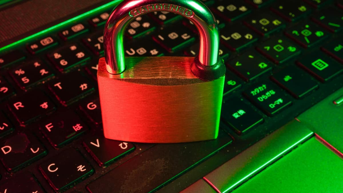 Padlock on a laptop keyboard symbolizing digital security